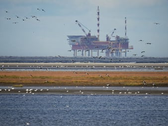 Oil Rig by a Lake